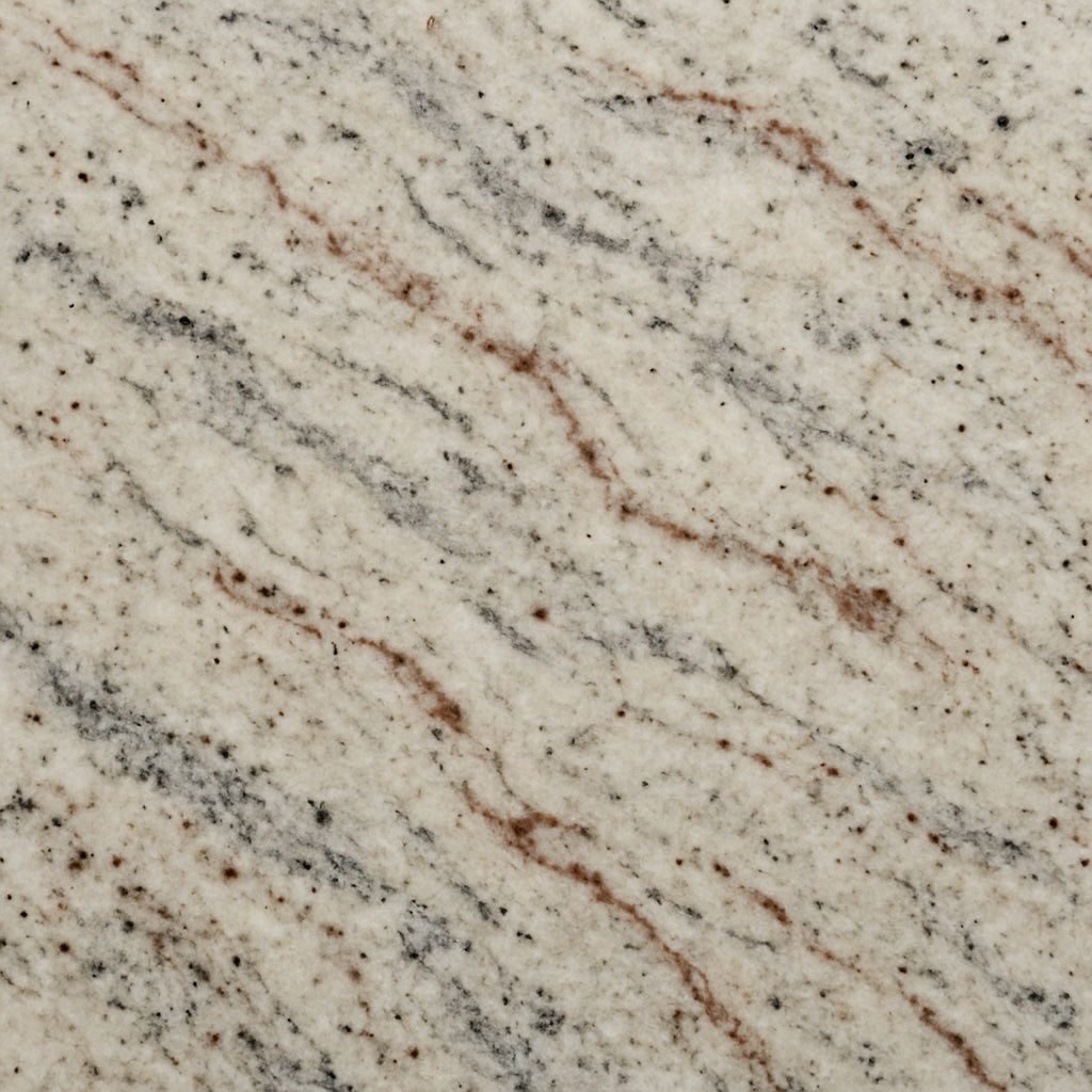Andromeda granite swatch with creamy white base and gray, black, and cinnamon veining—ideal for outdoor countertops and elegant stone surfaces.